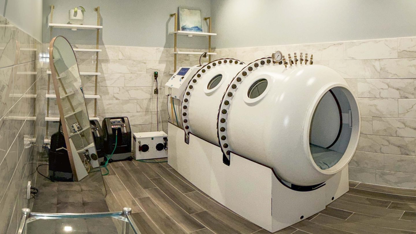 Hyperbaric oxygen therapy chamber in a treatment room at the SDBody La Jolla clinic