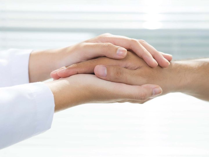 Physician reassuring a patient